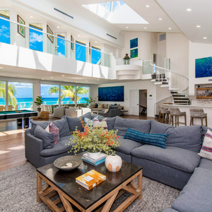 Seascape Villa Living room with ocean views and spiral staircase