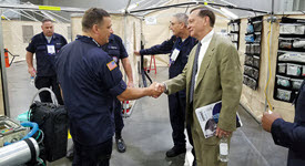 photo of Dr. Kadlec in front of NDMS Base of Operations tent