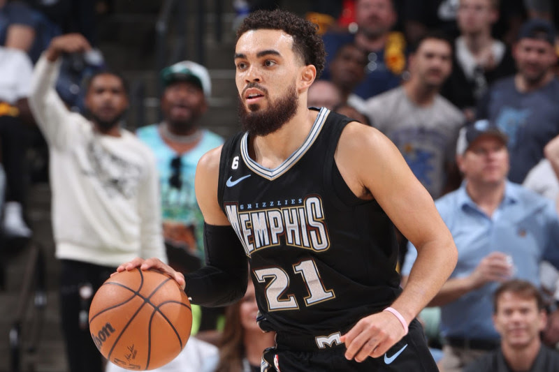 MEMPHIS, TN - APRIL 19: Tyus Jones #21 of the Memphis Grizzlies dribbles the ball during the game against the Los Angeles Lakers during Round One Game Two of the 2023 NBA Playoffs on April 19, 2023 at FedExForum in Memphis, Tennessee. NOTE TO USER: User expressly acknowledges and agrees that, by downloading and or using this photograph, User is consenting to the terms and conditions of the Getty Images License Agreement. Mandatory Copyright Notice: Copyright 2023 NBAE (Photo by Joe Murphy/NBAE via Getty Images)