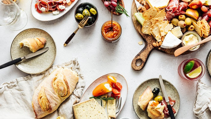 Overhead view of antipasto courses and charcuterie boards.