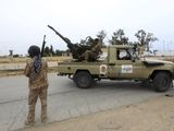 In this May 21, 2019 file photo, Tripoli government forces clash with forces led by Field Marshal Khalifa Hifter, south of the capital Tripoli, Libya. Two Libyan militia commanders and a Syrian war monitor group say Turkey is deploying Syrian extremists to fight in Libya&#39;s civil war. These extremists are affiliated with groups like al-Qaida and the Islamic State. They&#39;re fighting as mercenaries on behalf of the United Nations-supported government in Libya. The Libyan sources told The Associated Press that Turkey has airlifted more than 2,500 foreign fighters into Tripoli, and that dozens are extremist-affiliated. (AP Photo/Hazem Ahmed, File) **FILE**