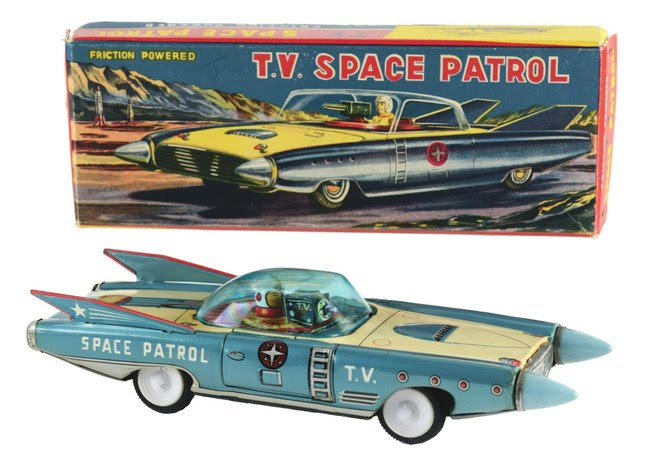 Postwar Japanese 'T.V. Space Patrol' futuristic tin friction car with astronaut driver and rotating video camera under plastic dome. Original pictorial box and tissue wrap. Estimate $3,000-$5,000