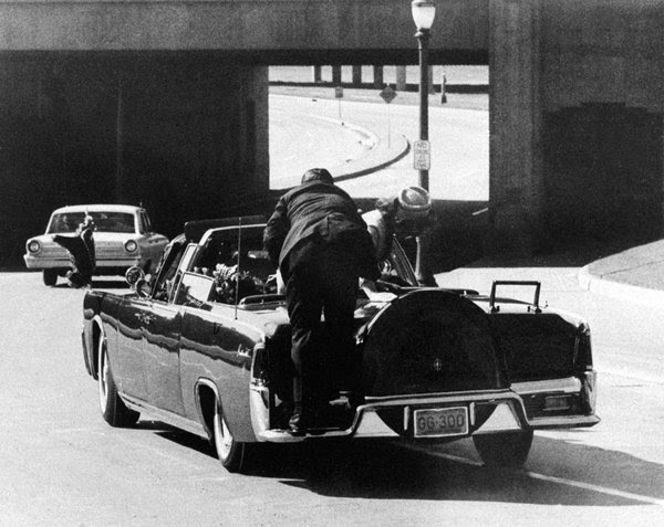 Clint Hill, who was in Jacqueline Kennedy's Secret Service detail, on the back of the limousine moments after the shooting on Nov. 22, 1963.