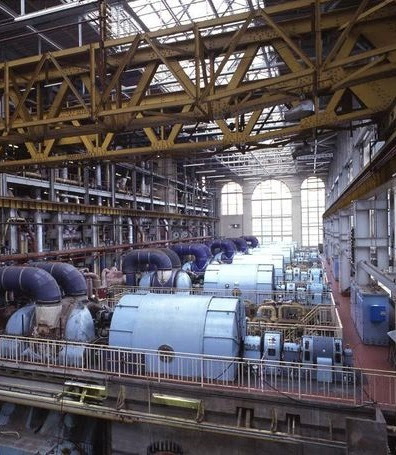 Photo showing interior of a vast industrial building containing machinery