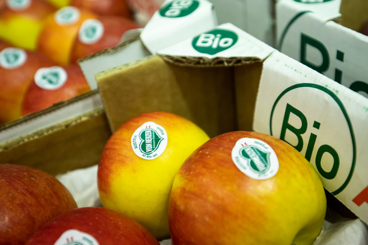 How apples prevent heart diseases Organic apples of the Topaz variety in crates at a stand during the organic trade fair Biofach