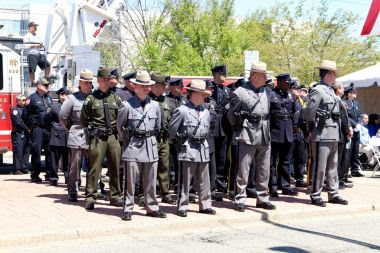 ECOs and other law enforcement agencies stand at attention during memorial