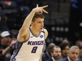 Sacramento Kings guard Bogdan Bogdanovic flashes three fingers after scoring a 3-point basket during the first quarter of the team&#39;s NBA basketball game against the Washington Wizards in Sacramento, Calif., Tuesday, March 3, 2020. (AP Photo/Rich Pedroncelli)