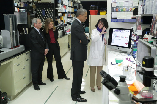 Dr. Nancy Sullivan of NIH’s National Institute of Allergy and Infectious Diseases (NIAID) discussing Ebola research with President Barack Obama as NIAID Director Dr. Anthony Fauci and HHS Secretary Sylvia Burwell look on. Dr. Nancy Sullivan of NIH’s National Institute of Allergy and Infectious Diseases (NIAID) discussing Ebola research with President Barack Obama as NIA