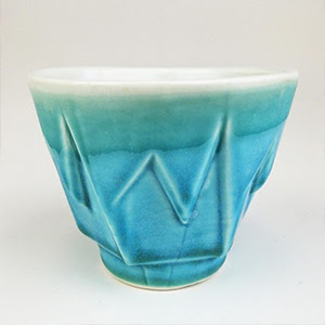 A photograph of a blue ceramics cup.