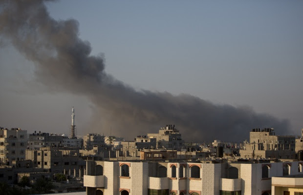 Smoke billows from buildings in Gaza City.
