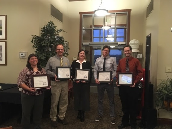 The five finalists stand holding their framed certificates for being state finalists for the Presidential Award for Excellence in Math and Science Teaching.