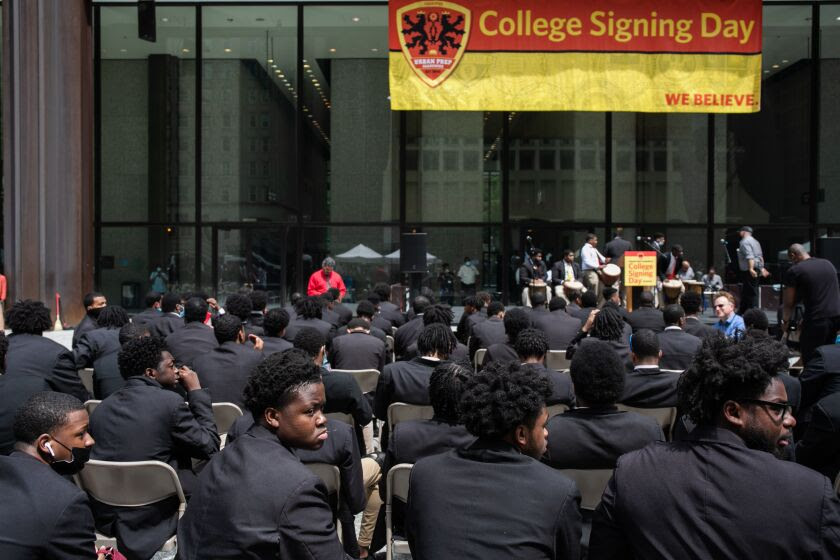 Urban Prep Academies graduating seniors wait on Daley Plaza for Thursday’s Signing Day ceremony to start.