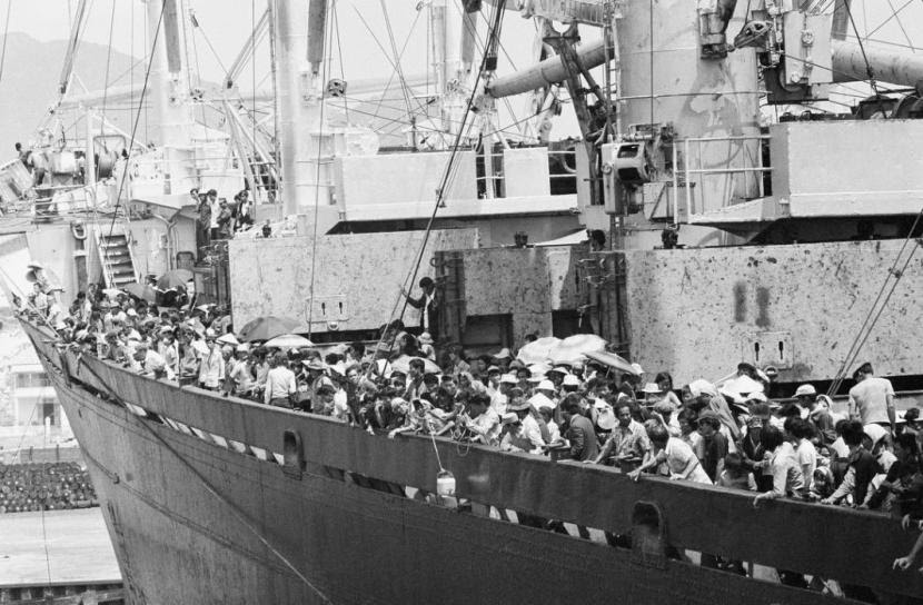 Teeming frightened humanity crowds the decks of the merchant vassal Pioneer Contender as it docks at Cam Ranh Bay on the central coast of South Vietnam, Friday, March 29, 1975. Ship carried 5,600 South Vietnamese refugees and about 40 Americans out of Danang, a refugee crammed city under the gun. (AP Photo/Huynh Cong/Ut)