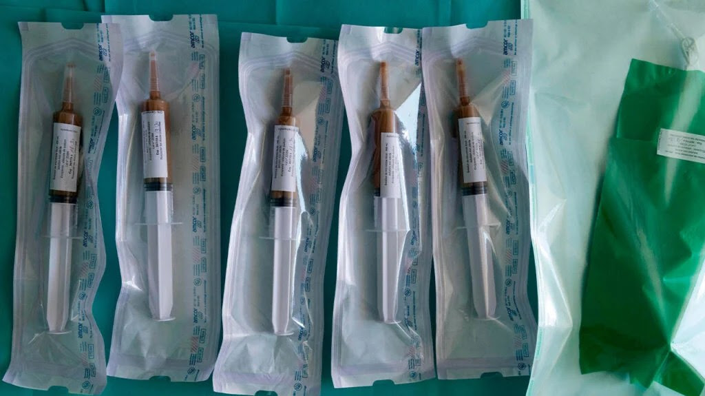 Four syringes full of fluid to help with an enema for a colonoscopy and fecal transplant