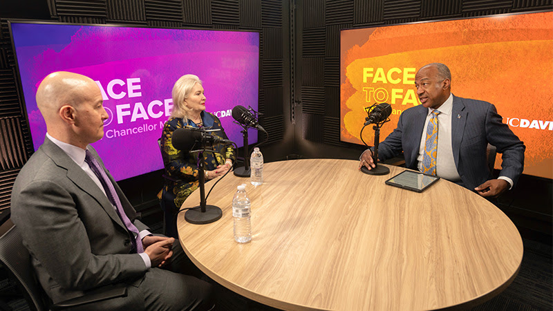 Chancellor Gary S. May interviews two guests in the Face to Face studio.