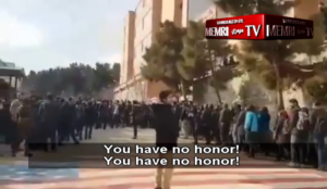 Iran: University students refuse to walk over US, Israeli flags, boo those who do