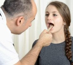 Pediatrician examining child