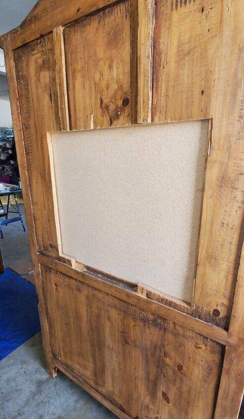 TV cutout on back of hutch covered by plywood