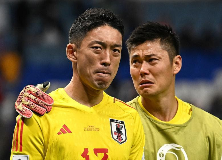 Japan's Shuichi Gonda and Eiji Kawashima look dejected after the penalty shootout as Japan are eliminated from the World Cup. REUTERS/Dylan Martinez
