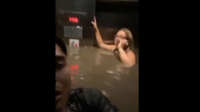 Durante cheias, amigos ficam presos em elevador inundado; veja