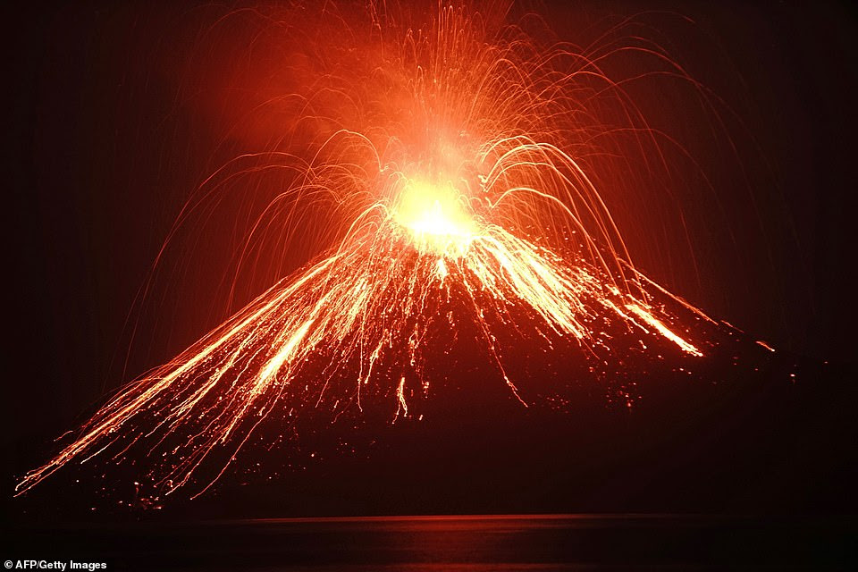It is believed the tsunami may have been caused by seismic activity from an eruption on Krakatoa (pictured here in July)