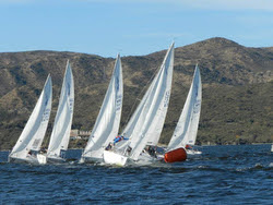 J/24s sailing past mark- Lago San Roque, Argentina