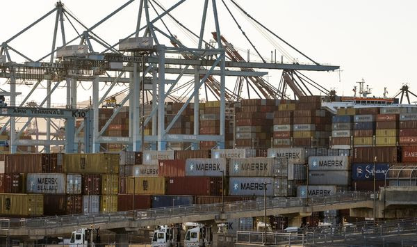 In this Tuesday, Oct. 19, 2021, file photo, shipping containers are stacked up at Maersk APM Terminals Pacific at the Port of Los Angeles. (AP Photo/Damian Dovarganes) ** FILE **