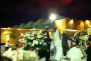 An Israeli wedding couple flees seconds after a rocket exploded overhead at their wedding.