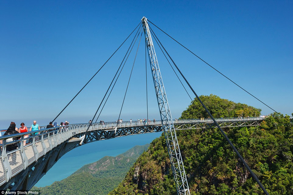 Completed in 2004, the Langkawi Sky Bridge is built on top of the Machinchang mountain in Malaysia and hangs at about 328 ft above the ground. The walkway can accommodate up to 250 people at the same time and swings out over the landscape to give visitors a unique look at the landscape