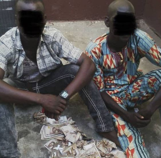 Lagos Police shares hilarious throwback photos of when they arrested two criminals who stuffed money in their pants