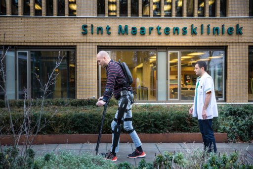 Paralyzed man walks with an exosketelon