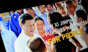The title screen of a program called “How Xi Jinping Pursues Happiness For People” from the CGTN archive is seen as it plays on a computer monitor in London.