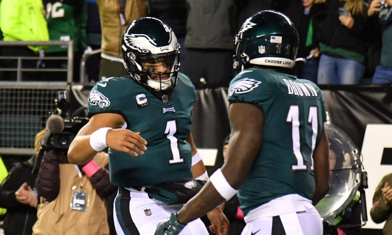 Eagles' QB Jalen Hurts (#1) and WR A.J. Brown (#11) celebrate a touchdown for the Eagles in Sunday's playoff game against the Giants.