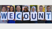 We Count placards held by community members