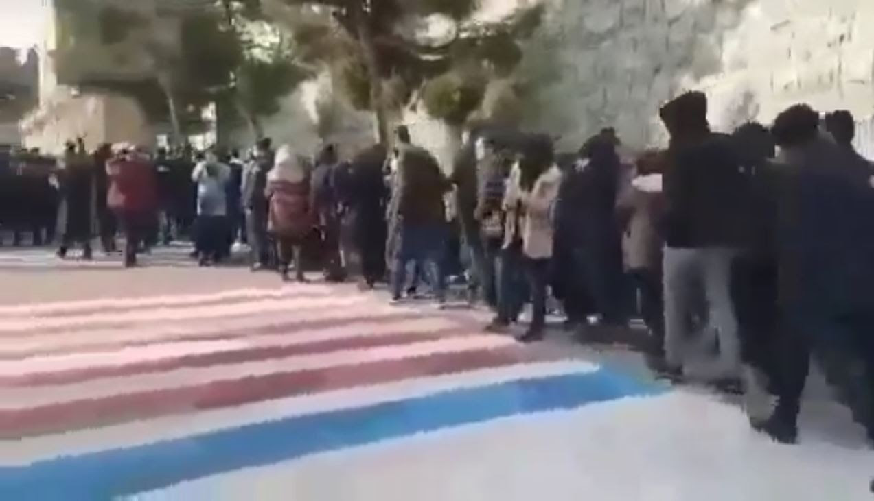 Students avoided walking on the flags painted by the regime at the entrance of the university