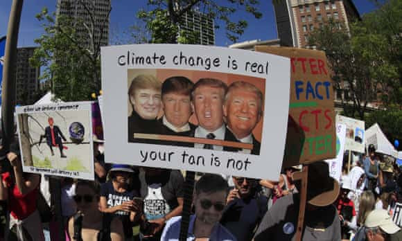 Climate protester with Trump sign