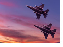 Jets flying in a sunset sky.