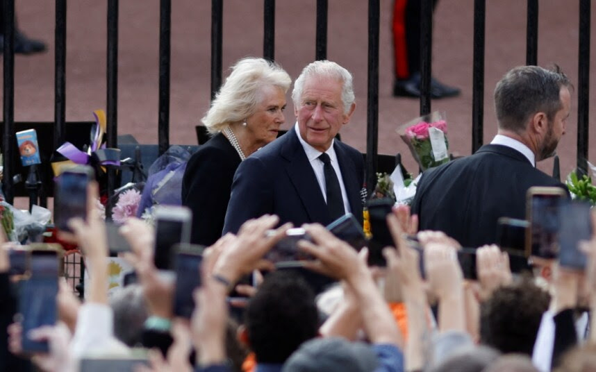 The King greets mourners at Buckingham Palace