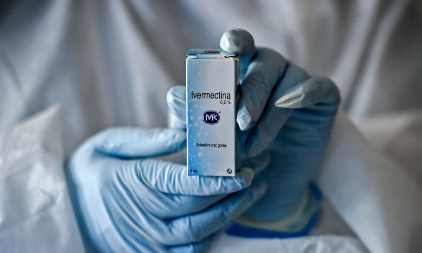 A health worker shows a box containing a bottle of ivermectin in Cali, Colombia, on July 21, 2020. (Luis Robayo/AFP via Getty Images)