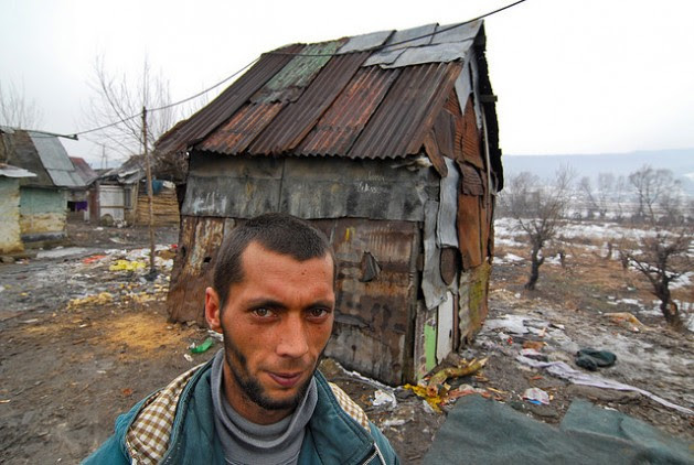 A man lives in the makeshift house behind him in the Slovak Republic, a member of the EU. Photo: Mano Strauch © The World Bank