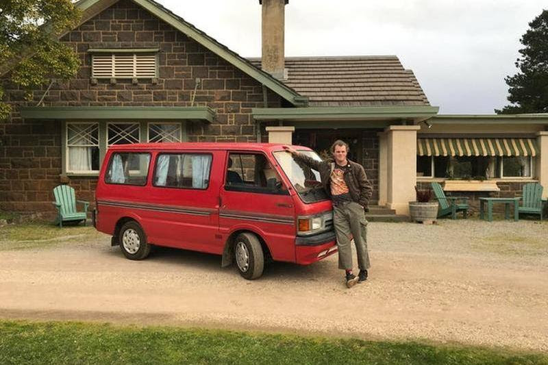 Man in front of his bus