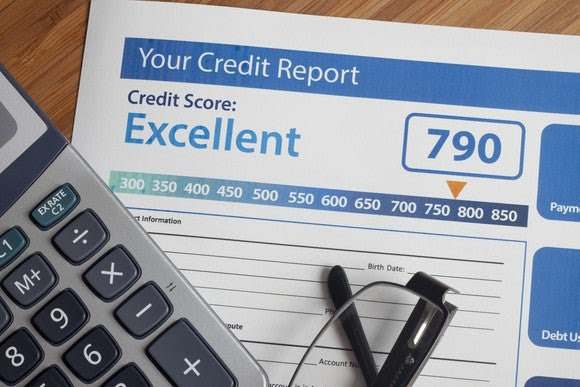 A piece of paper that says, “Your credit score: Excellent”