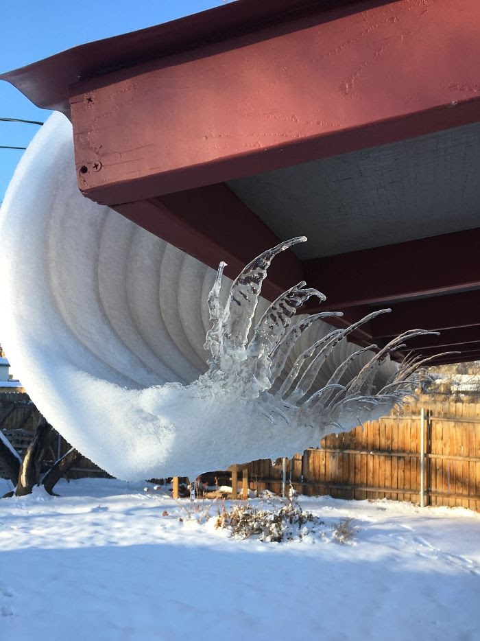 This                                                           Crazy Ice Wave                                                           Formation From                                                           Snow Slowly                                                           Melting Off                                                           The Tin Roof                                                           Of My Patio