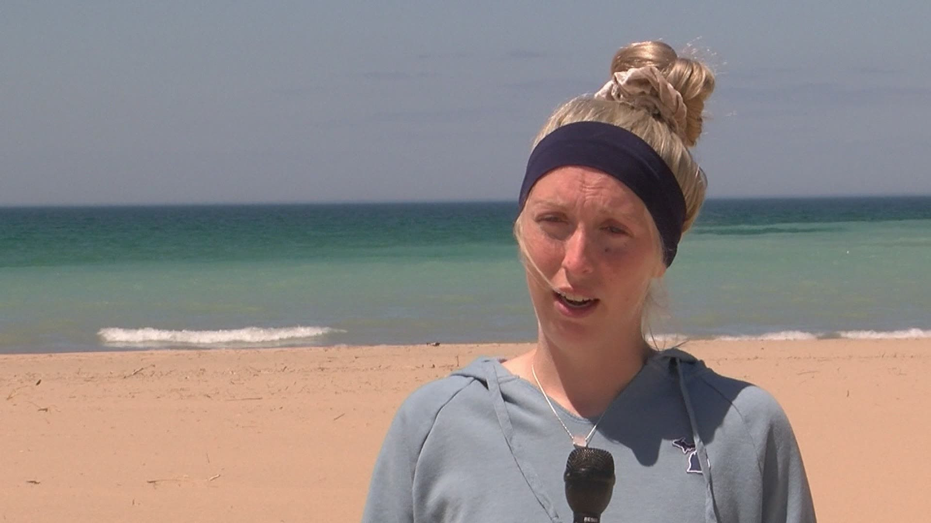 Woman giving an interview at a beach