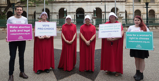 Handmaids with placards