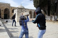 Masked Palestinian Authority Arabs hurl blocks at Israel Police during and after 