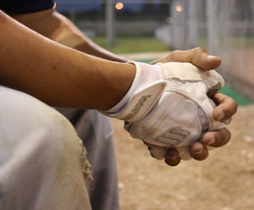 Baseball player sitting on bench