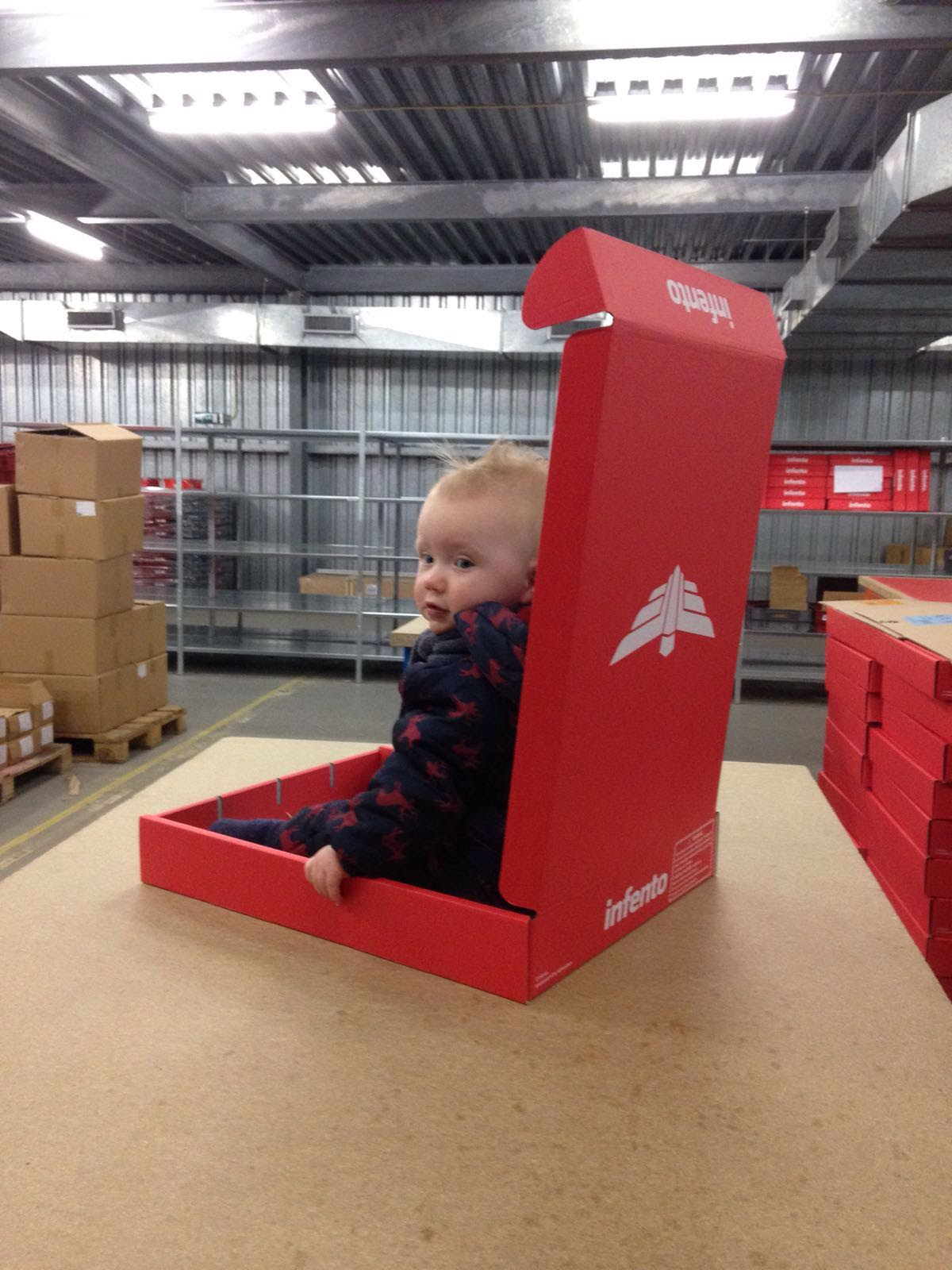 a cute toddler in infento box