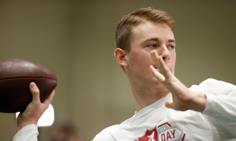 Mac Jones attempting to throw the ball at Alabama's Pro Day