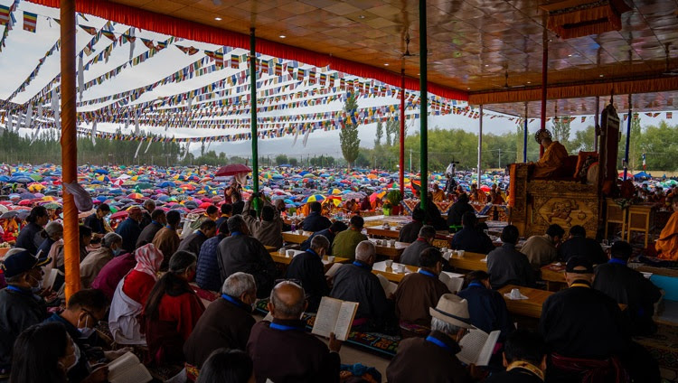 Umbrellas covering most of the crowd as rain falls during the second day of His Holiness the Dalai Lama's teachings at the Shewatsel Teaching Ground in Leh, Ladakh, UT, India on July 29, 2022. Photo by Tenzin Choejor